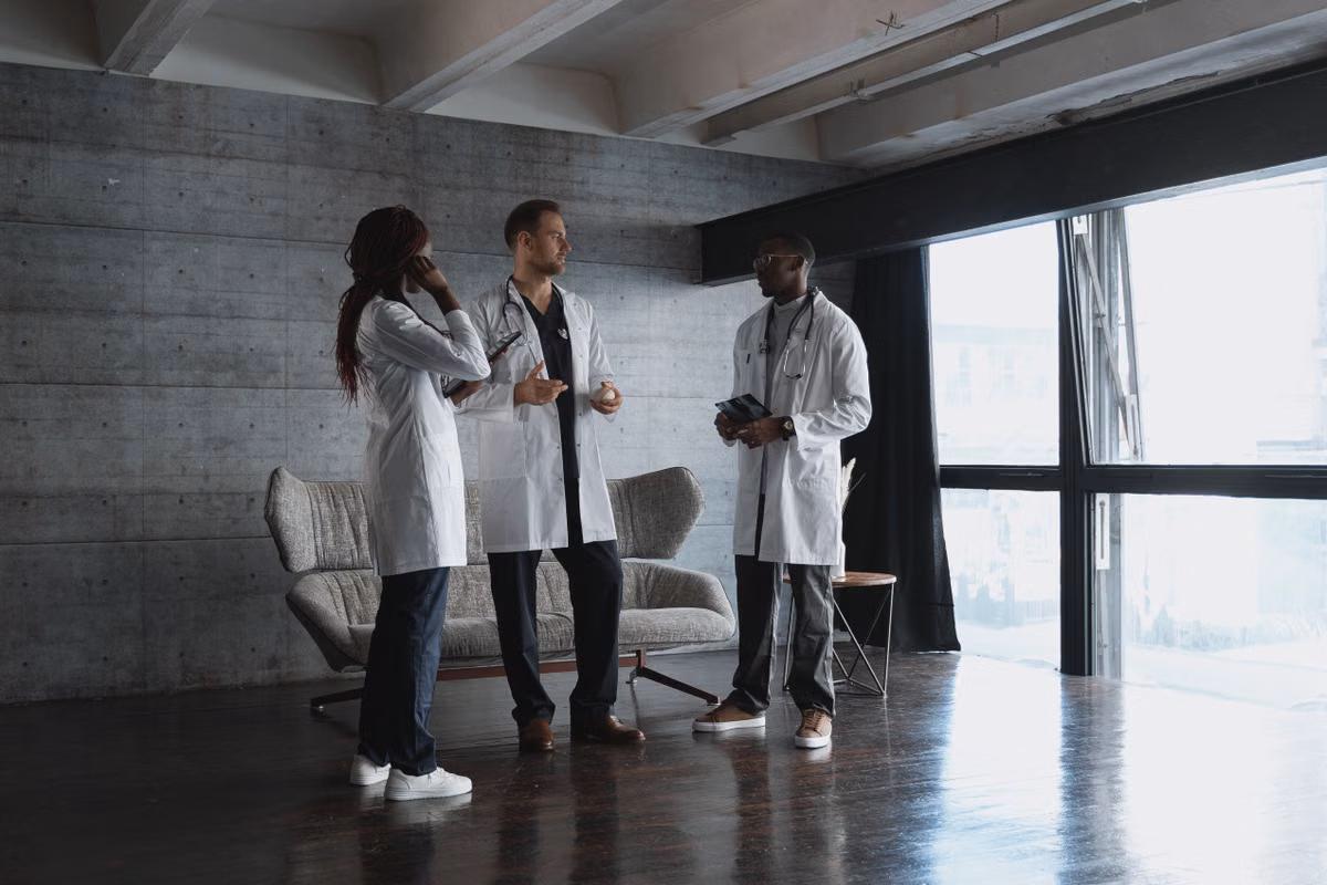 Medical professionals discussing patient care in a modern office